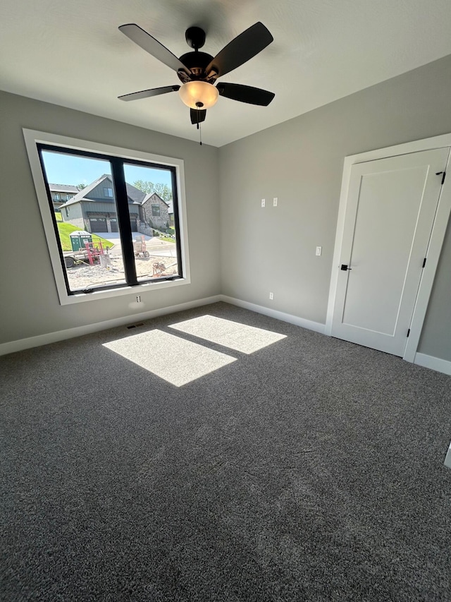 5958 S Clay Ave, Springfield, MO 65810 - unfurnished room featuring carpet floors, ceiling fan, and baseboards