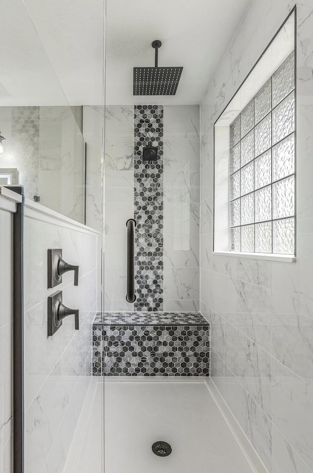 bathroom featuring a shower stall