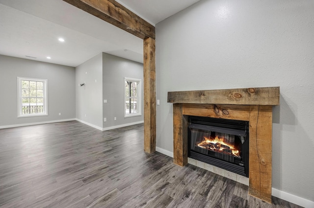 unfurnished living room featuring a tile fireplace, wood finished floors, recessed lighting, and baseboards