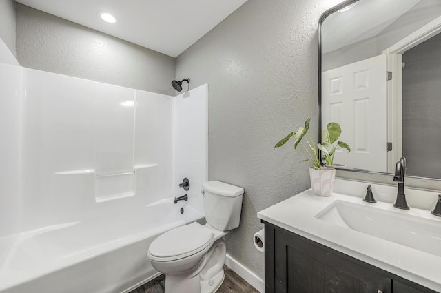 full bath featuring wood finished floors, a textured wall, toilet, and baseboards