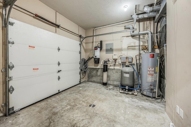 garage featuring water heater and electric panel