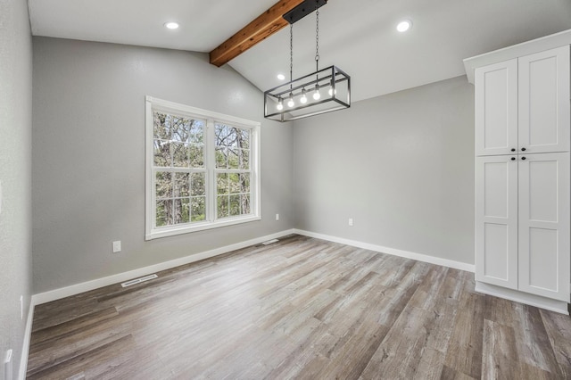 unfurnished dining area featuring baseboards, recessed lighting, vaulted ceiling with beams, and light wood-style flooring