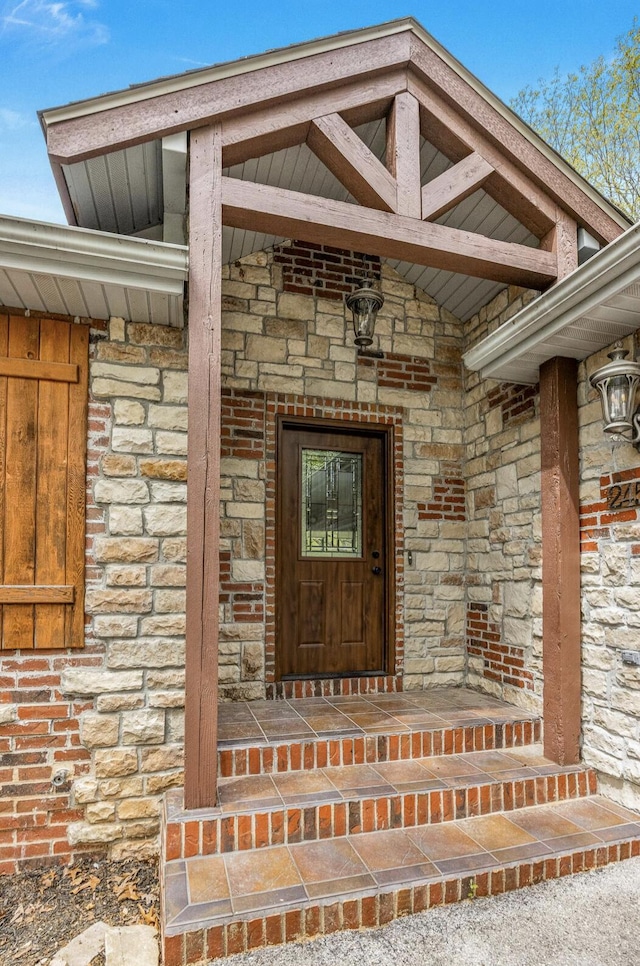 entrance to property with stone siding