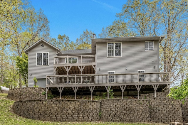 back of house with a wooden deck