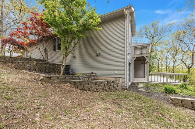 view of property exterior featuring a wooden deck