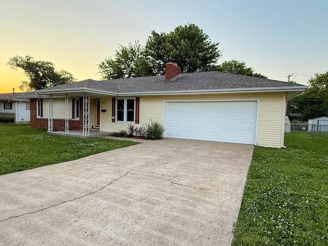 213 W Charles St, Republic, MO 65738 - ranch-style home with driveway, a lawn, a chimney, a garage, and covered porch