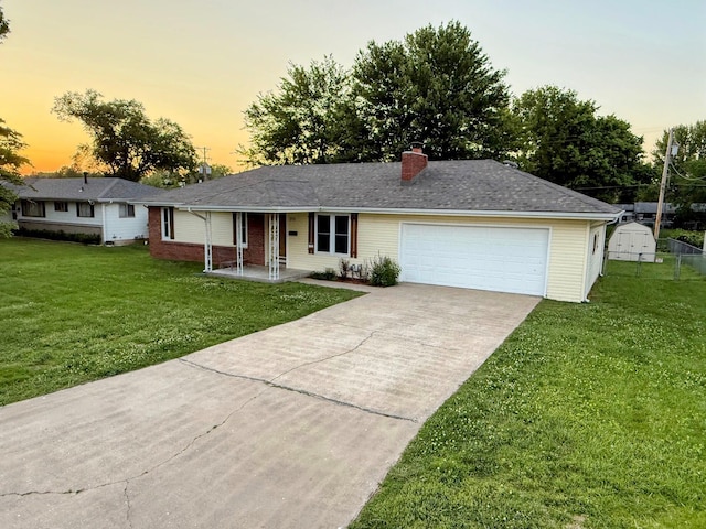 213 W Charles St, Republic, MO 65738 - ranch-style house featuring a yard, driveway, a chimney, and an attached garage