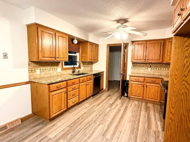 213 W Charles St, Republic, MO 65738 - kitchen featuring black dishwasher, a sink, a ceiling fan, brown cabinetry, and a textured ceiling