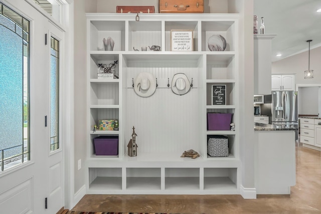 mudroom featuring built in features and baseboards