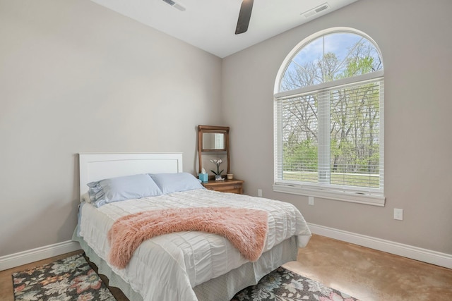 bedroom with visible vents, baseboards, and multiple windows