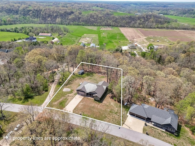 birds eye view of property with a rural view and a forest view