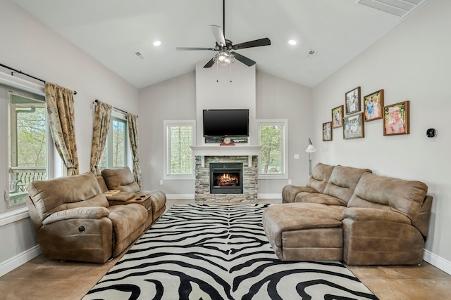 living room featuring visible vents, ceiling fan, a healthy amount of sunlight, and baseboards