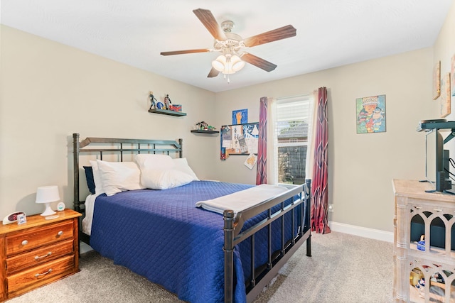 bedroom with carpet, ceiling fan, and baseboards