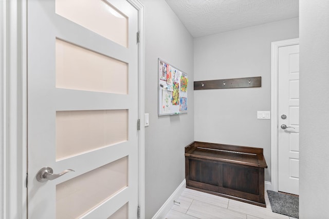 entryway featuring baseboards