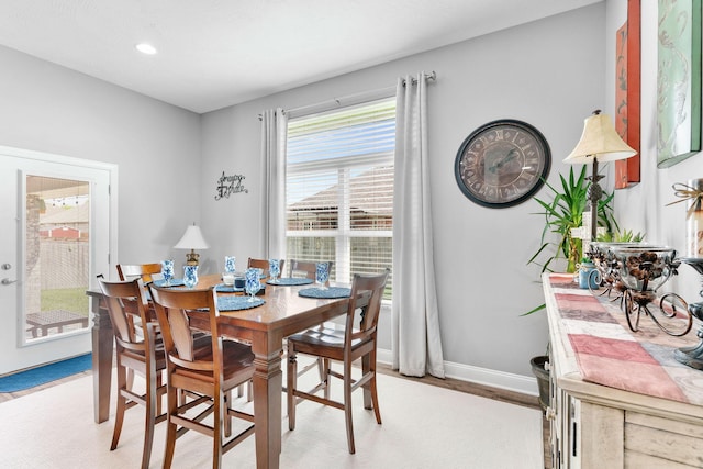 dining area with light wood-style floors, plenty of natural light, recessed lighting, and baseboards