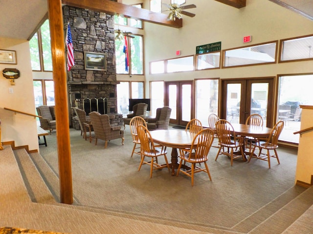 1901 Paradise Landing Rd Unit 1, Kimberling City, MO 65686 - carpeted dining room with a stone fireplace, a ceiling fan, high vaulted ceiling, and french doors