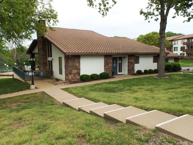 1901 Paradise Landing Rd Unit 1, Kimberling City, MO 65686 - view of front facade featuring a chimney, stucco siding, a front yard, and stone siding