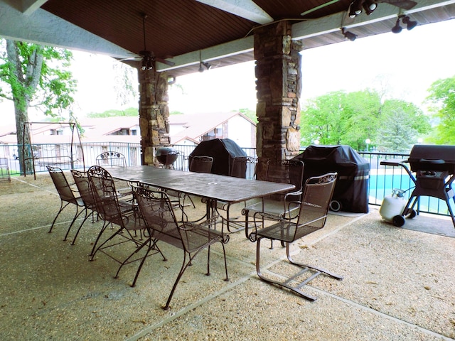 1901 Paradise Landing Rd Unit 1, Kimberling City, MO 65686 - view of patio with ceiling fan, fence, a grill, a pool, and outdoor dining space