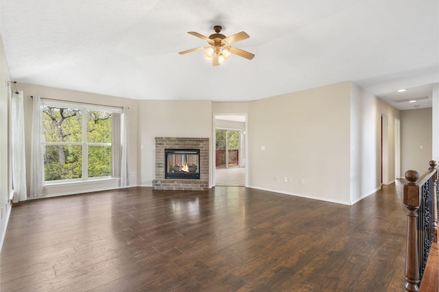 unfurnished living room with ceiling fan, a wealth of natural light, and wood finished floors