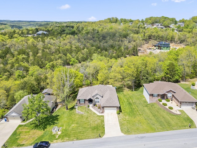 drone / aerial view featuring a view of trees