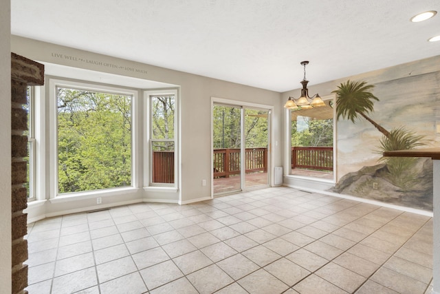 unfurnished dining area with light tile patterned floors, visible vents, baseboards, an inviting chandelier, and recessed lighting