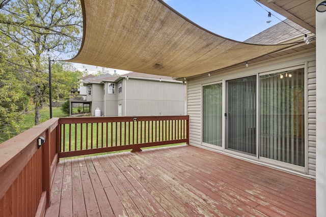 deck featuring a lawn