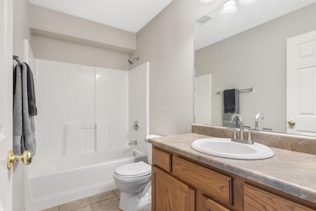 full bathroom with vanity, toilet, visible vents, bathtub / shower combination, and tile patterned flooring