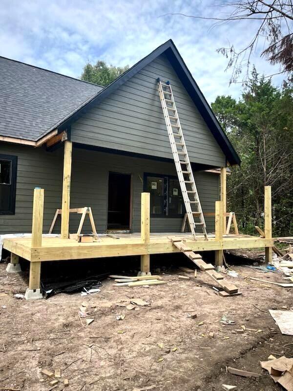 447 S Heatherwood Rd, Shell Knob, MO 65747 - back of house with a shingled roof and a deck