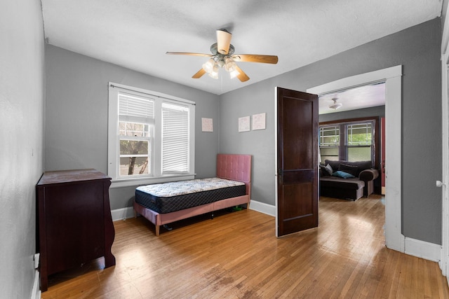 937 S Fremont Ave, Springfield, MO 65804 - bedroom with ceiling fan, hardwood / wood-style flooring, and baseboards