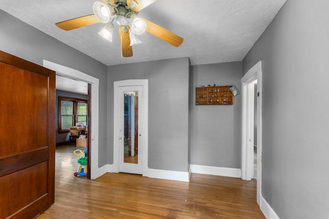 937 S Fremont Ave, Springfield, MO 65804 - interior space with a ceiling fan, a textured ceiling, wood finished floors, and baseboards
