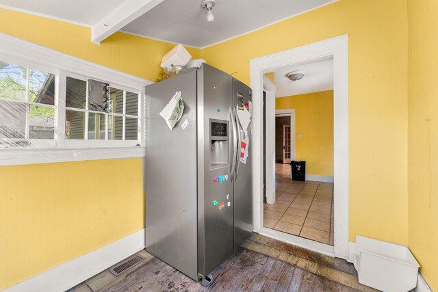 937 S Fremont Ave, Springfield, MO 65804 - kitchen featuring stainless steel refrigerator with ice dispenser, visible vents, wood finished floors, and baseboards
