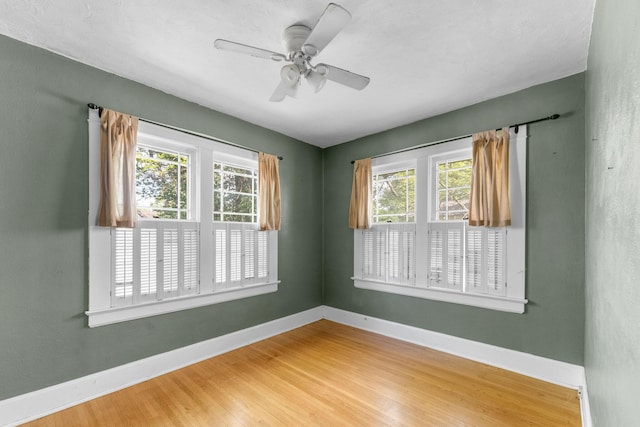 937 S Fremont Ave, Springfield, MO 65804 - spare room with baseboards, wood finished floors, and ceiling fan