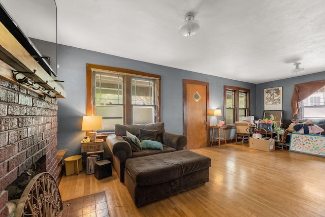 937 S Fremont Ave, Springfield, MO 65804 - living room featuring a fireplace and wood finished floors