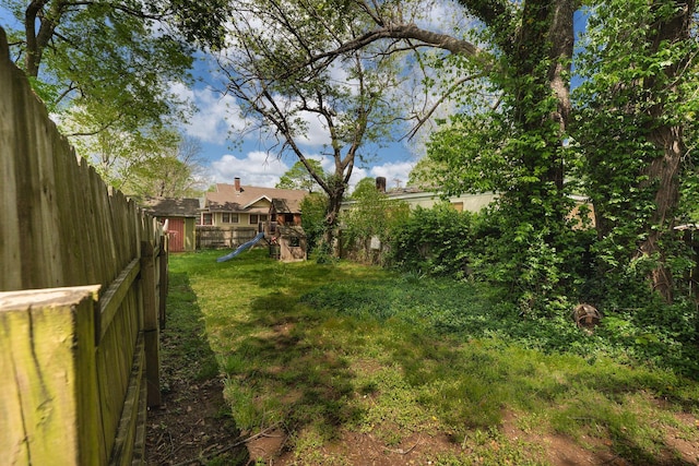 937 S Fremont Ave, Springfield, MO 65804 - view of yard with a fenced backyard and a playground