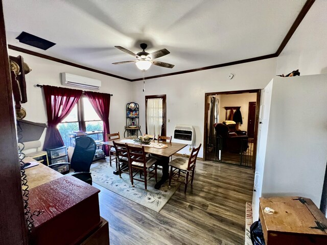 dining room with wood finished floors, a wall mounted air conditioner, ornamental molding, and a ceiling fan
