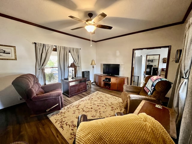 living room with dark wood-style floors, ceiling fan, and crown molding