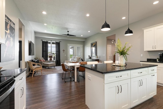 2460 S Durango Dr, Bolivar, MO 65613 - kitchen with dark wood-style flooring, open floor plan, electric range oven, and recessed lighting