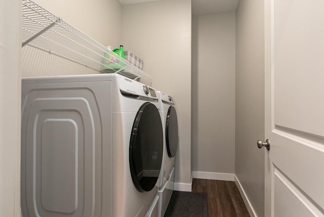 2460 S Durango Dr, Bolivar, MO 65613 - clothes washing area featuring washing machine and dryer, baseboards, laundry area, and dark wood-type flooring