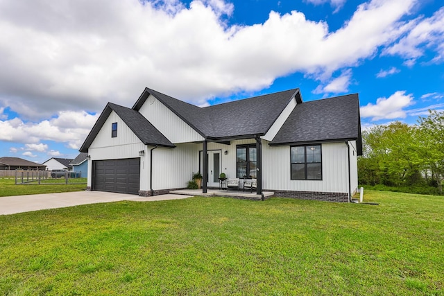 2460 S Durango Dr, Bolivar, MO 65613 - modern farmhouse style home featuring a garage, a front lawn, concrete driveway, and roof with shingles