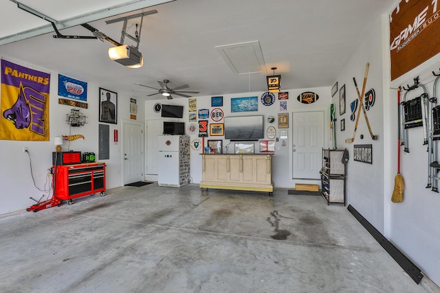 2460 S Durango Dr, Bolivar, MO 65613 - garage with a garage door opener, ceiling fan, and electric panel