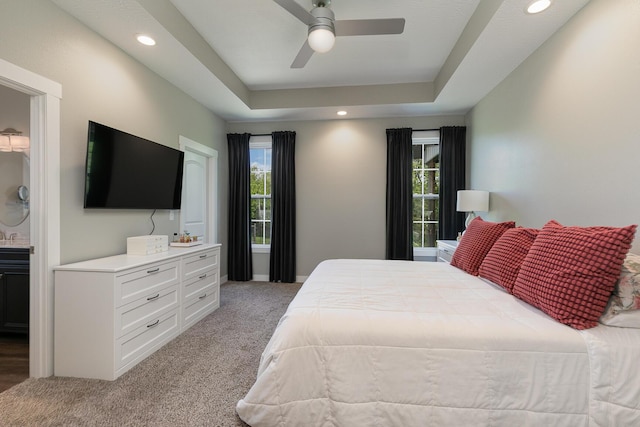 2460 S Durango Dr, Bolivar, MO 65613 - bedroom featuring recessed lighting, light carpet, connected bathroom, and a tray ceiling