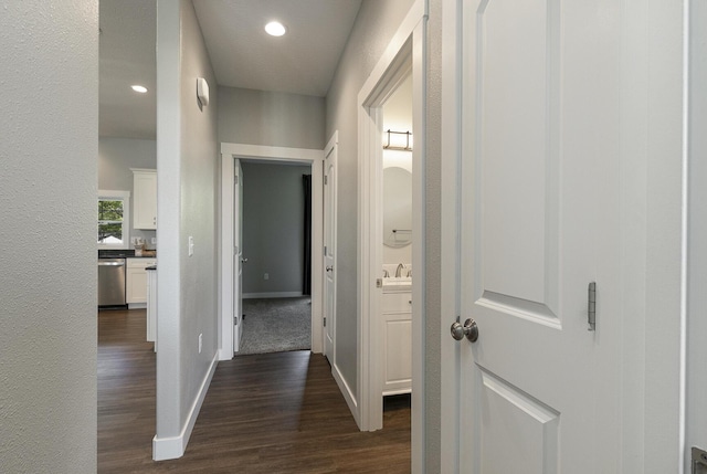 2460 S Durango Dr, Bolivar, MO 65613 - hallway with dark wood-style floors, baseboards, a sink, and recessed lighting