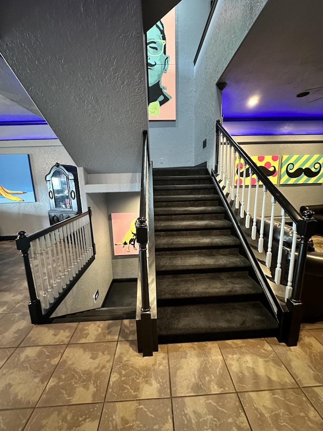 48 King Cir, Branson, MO 65616 - stairs featuring tile patterned flooring and a textured wall