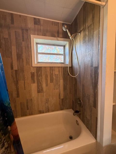 full bath featuring shower / bath combination with curtain