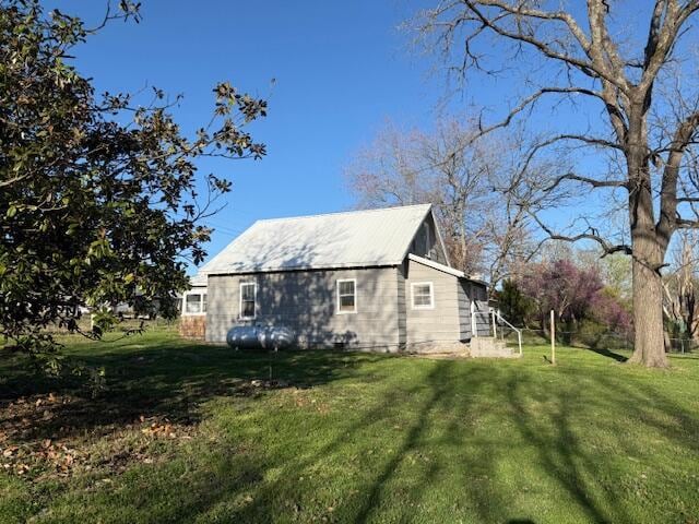 view of home's exterior featuring a lawn