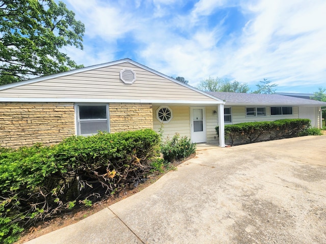 view of front of home with stone siding