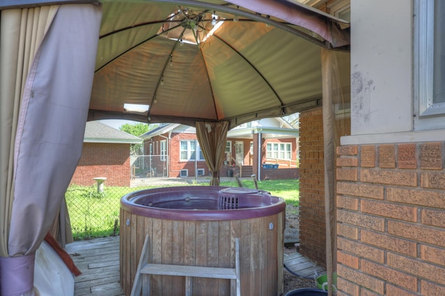 110 N Connor Ave, Joplin, MO 64801 - wooden terrace featuring a gazebo and a hot tub