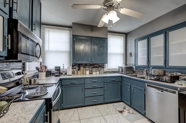 110 N Connor Ave, Joplin, MO 64801 - kitchen featuring ceiling fan, plenty of natural light, appliances with stainless steel finishes, and a sink
