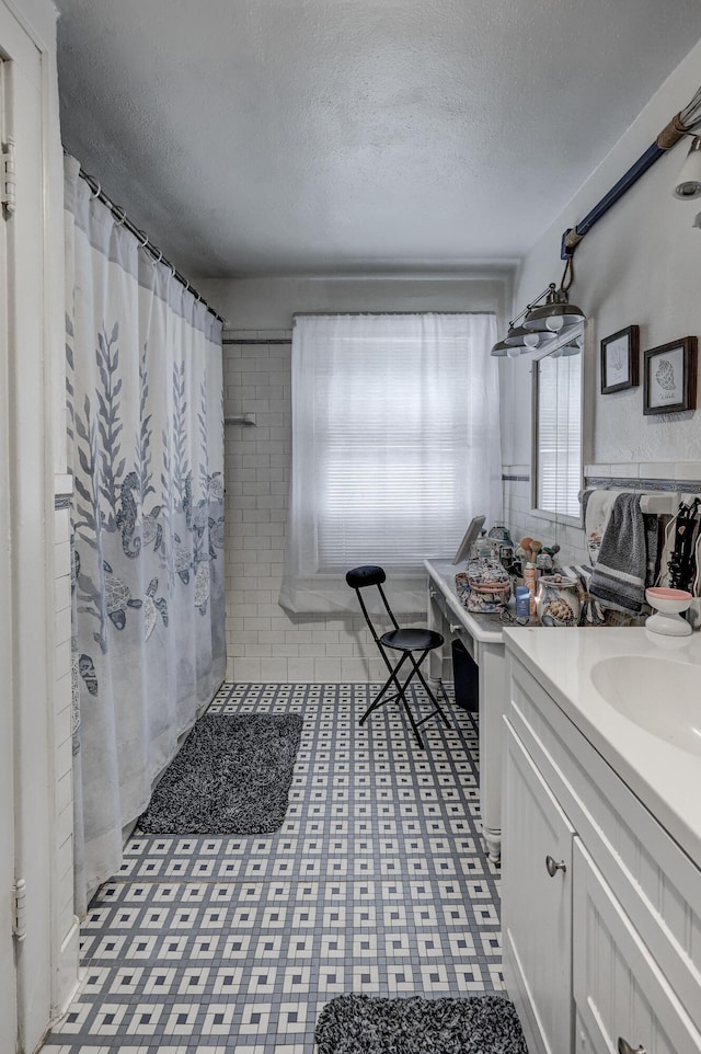 110 N Connor Ave, Joplin, MO 64801 - full bathroom with a textured ceiling, curtained shower, and vanity