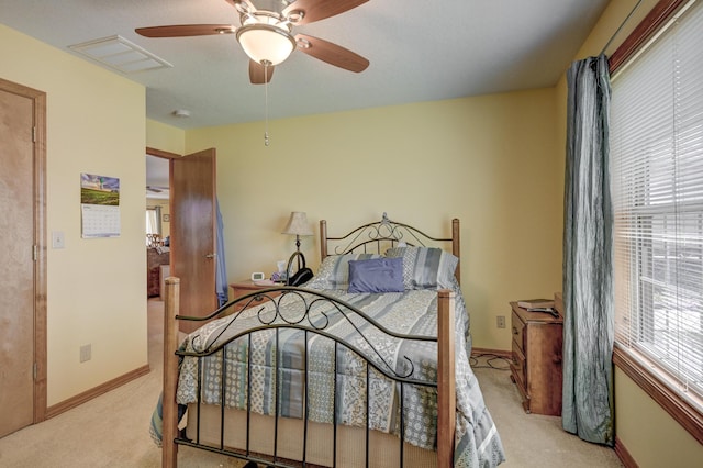 bedroom featuring visible vents, ceiling fan, carpet floors, and baseboards